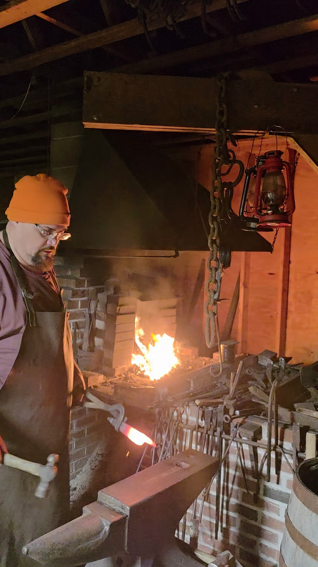 Sam Smith working hot steel beside a traditional forge